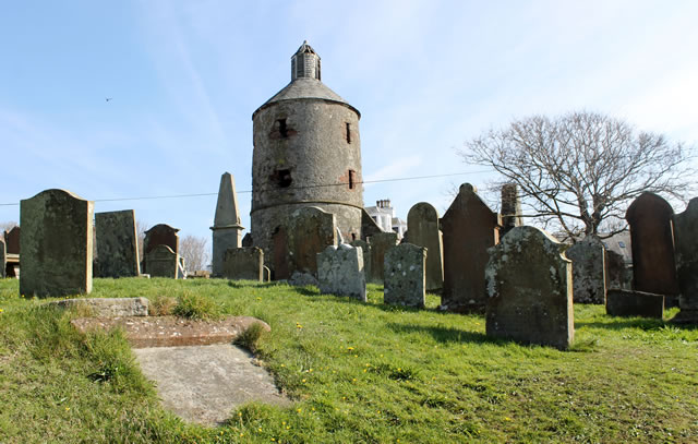 Photograph of the church tower and graveyard.